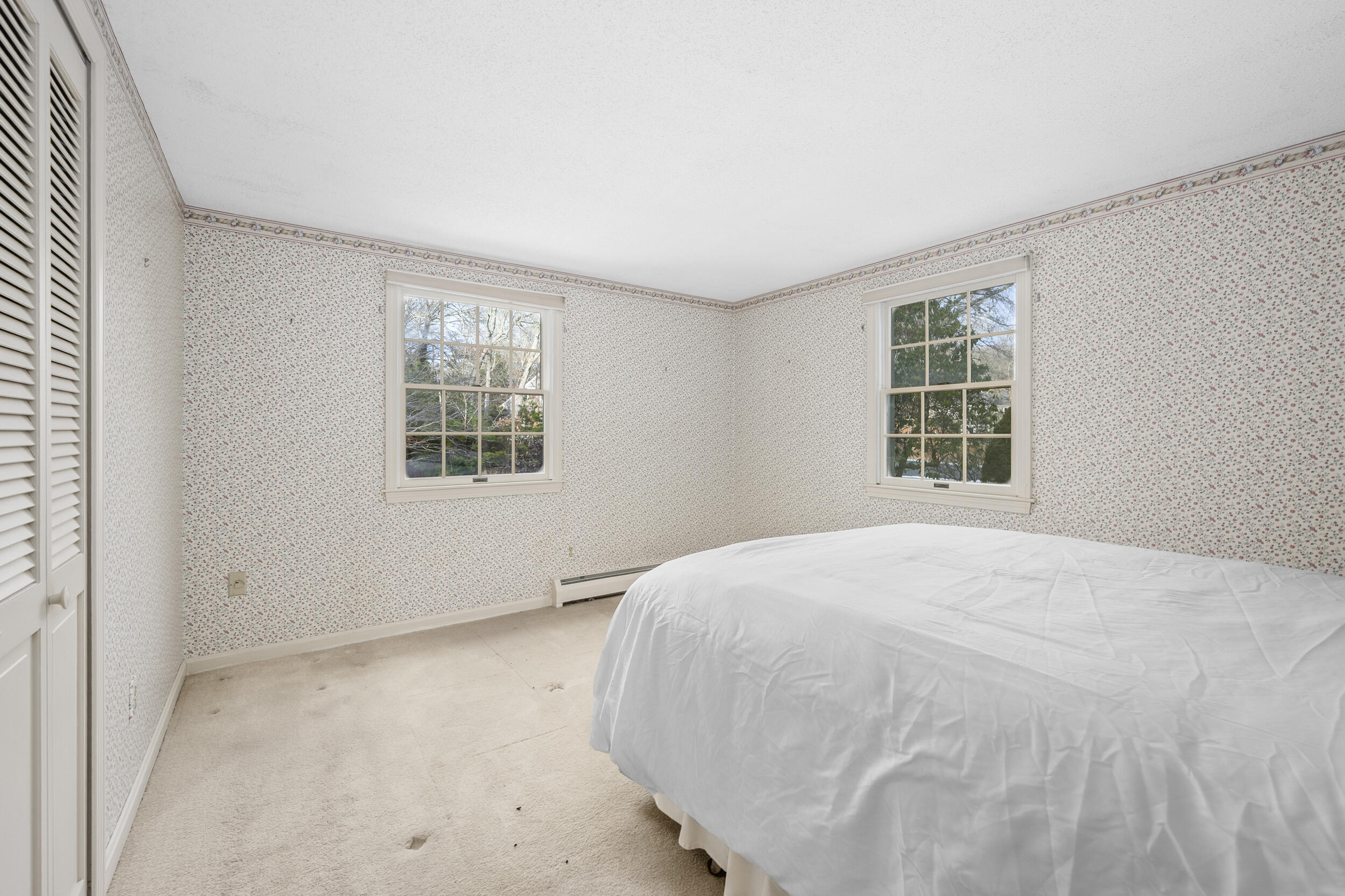 3 Nickerson Road Orleans, MA 02653 - Photo 13 of 30 a view of a bedroom with a bed and a window