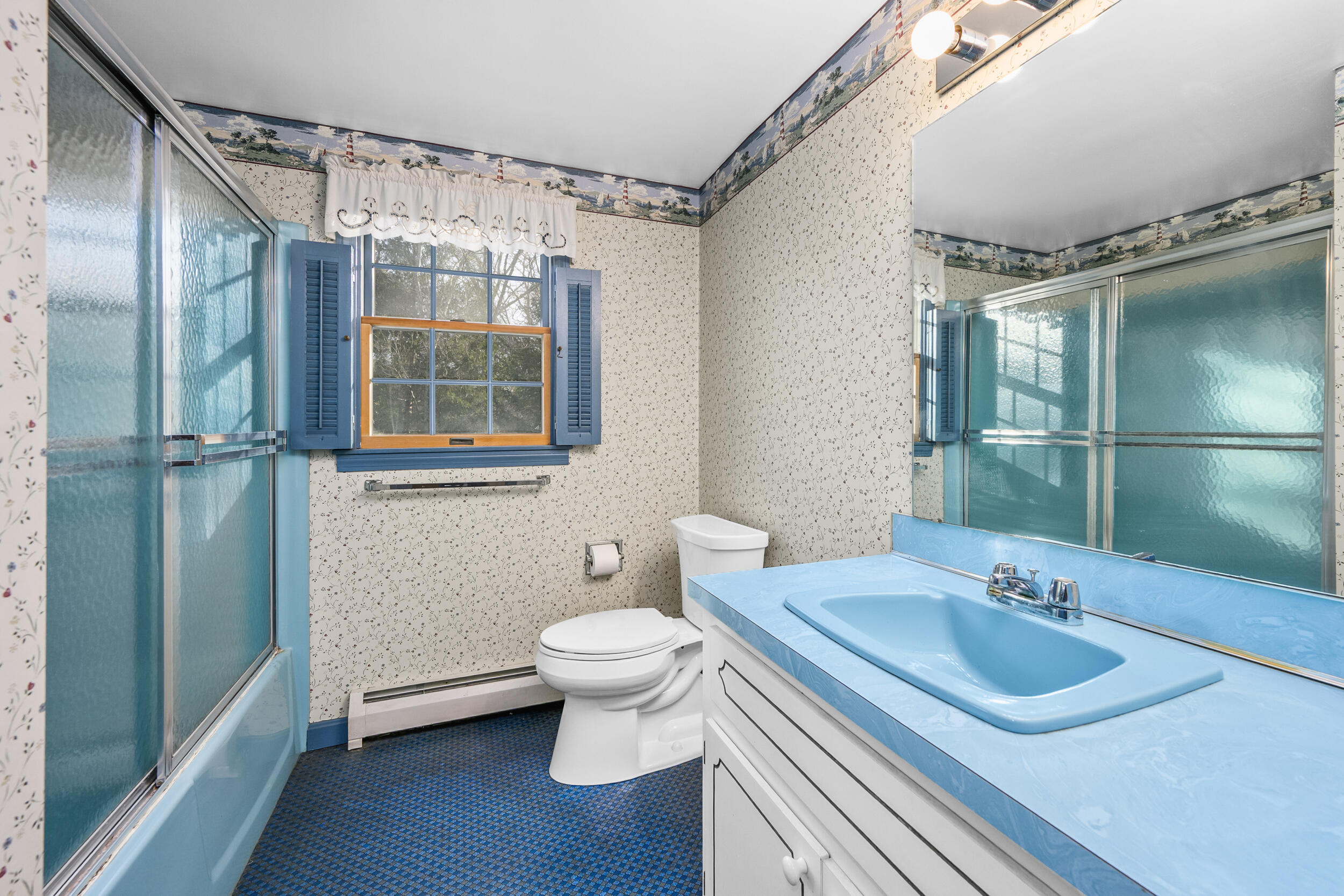 3 Nickerson Road Orleans, MA 02653 - Photo 18 of 30 a bathroom with a sink toilet a mirror and shower