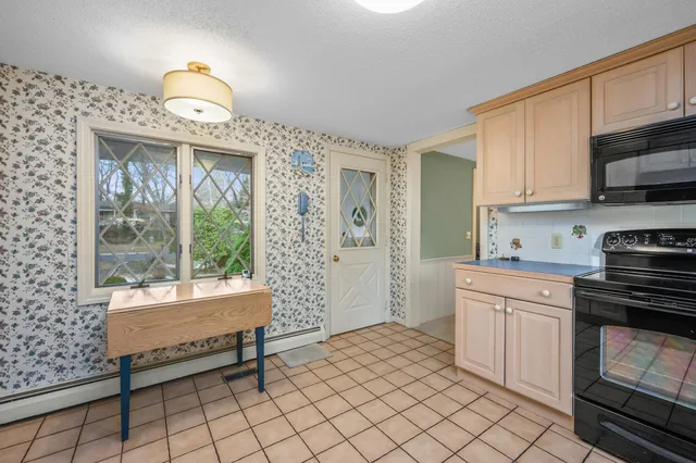 a kitchen that has a sink and a stove