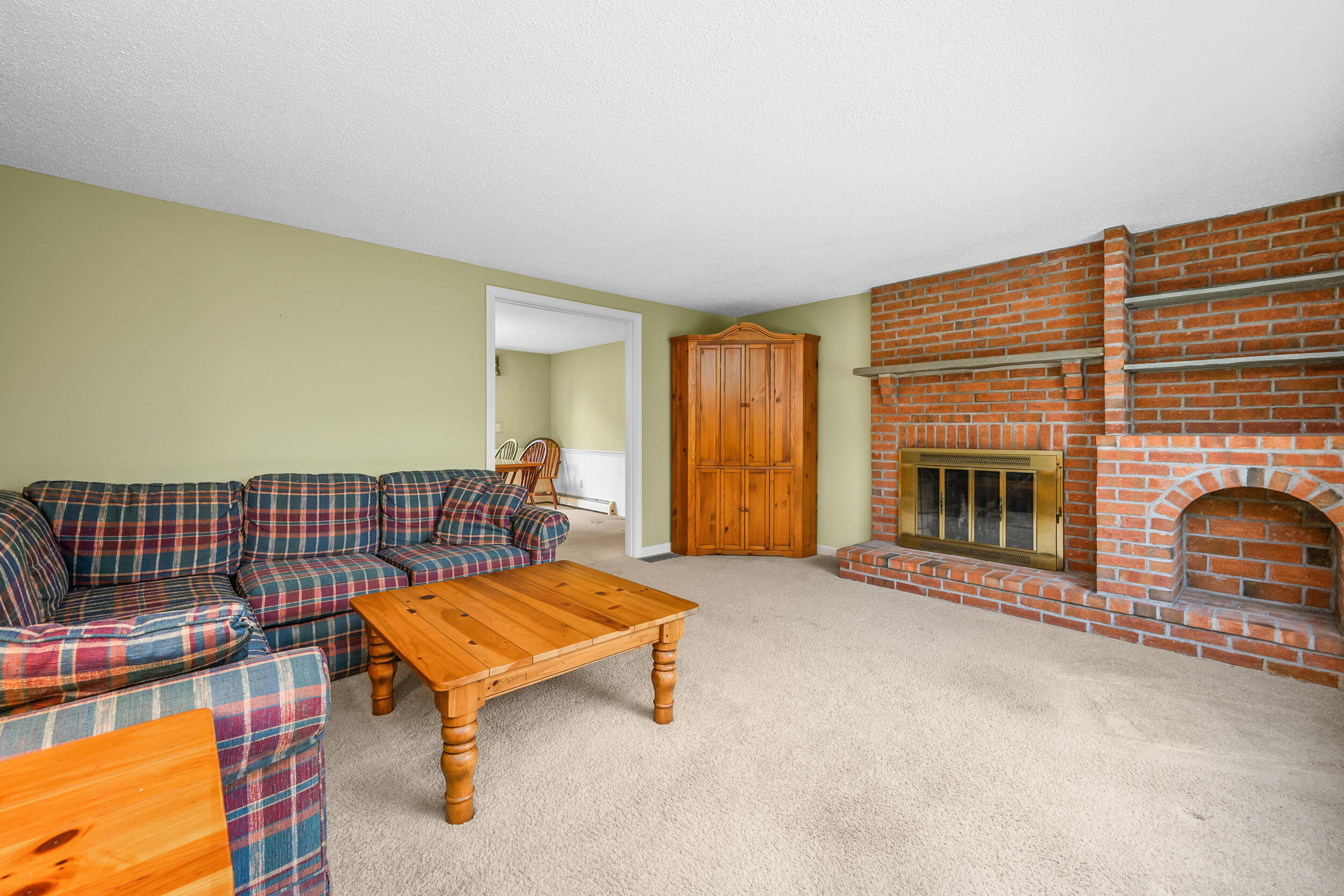 3 Nickerson Road Orleans, MA 02653 - Photo 9 of 30 a living room with a couch and a fireplace