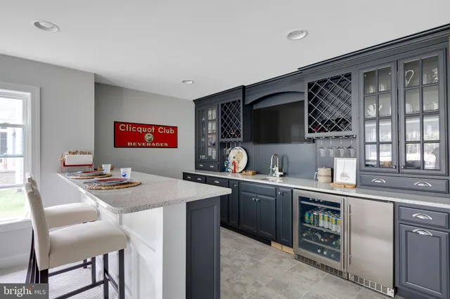a kitchen with a sink stove and microwave