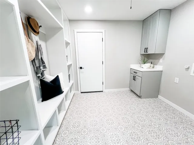 a bathroom with a double vanity sink toilet and shower