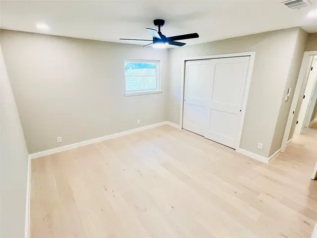 a bathroom with a double vanity sink toilet mirror and bathtub
