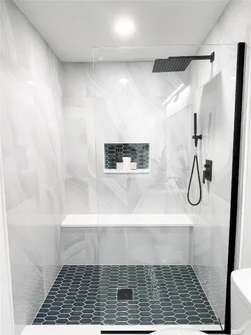 a view of a porch with furniture and garden