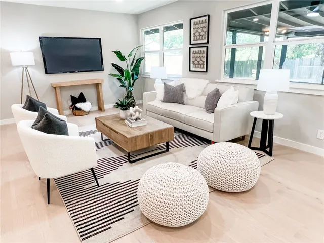 a kitchen with a stove and white cabinets