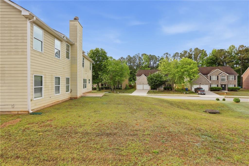 4968 Locherby Drive Fairburn, GA 30213 - Photo 38 of 39 a house with a yard