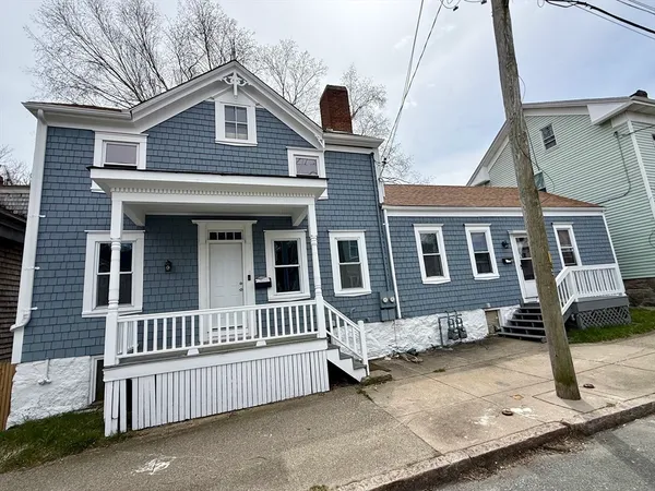 a front view of a house with stairs