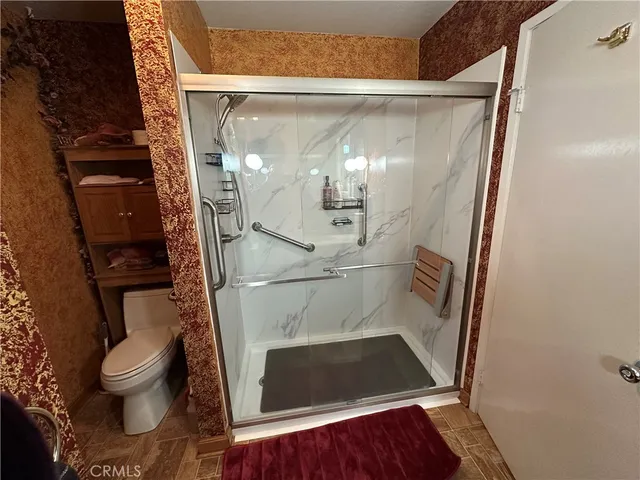 a view of living room with furniture and wooden floor