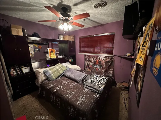 a bed sitting in a room next to a window