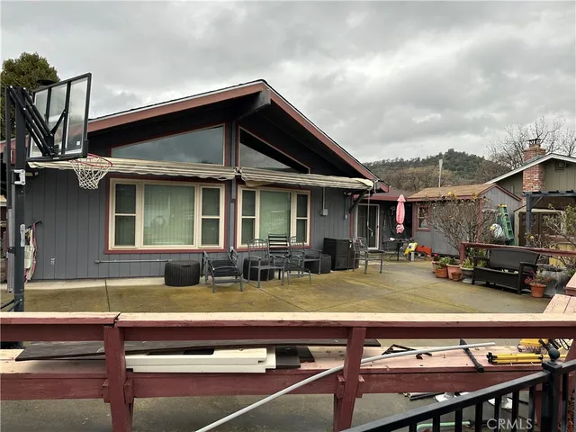 a view of house with outdoor seating