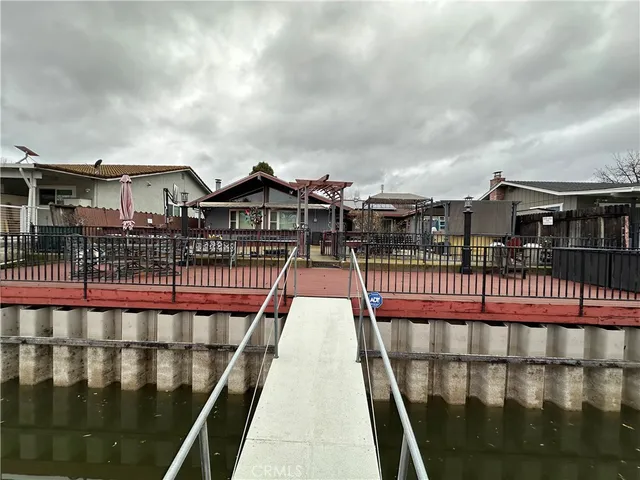 a view of a balcony with wooden fence