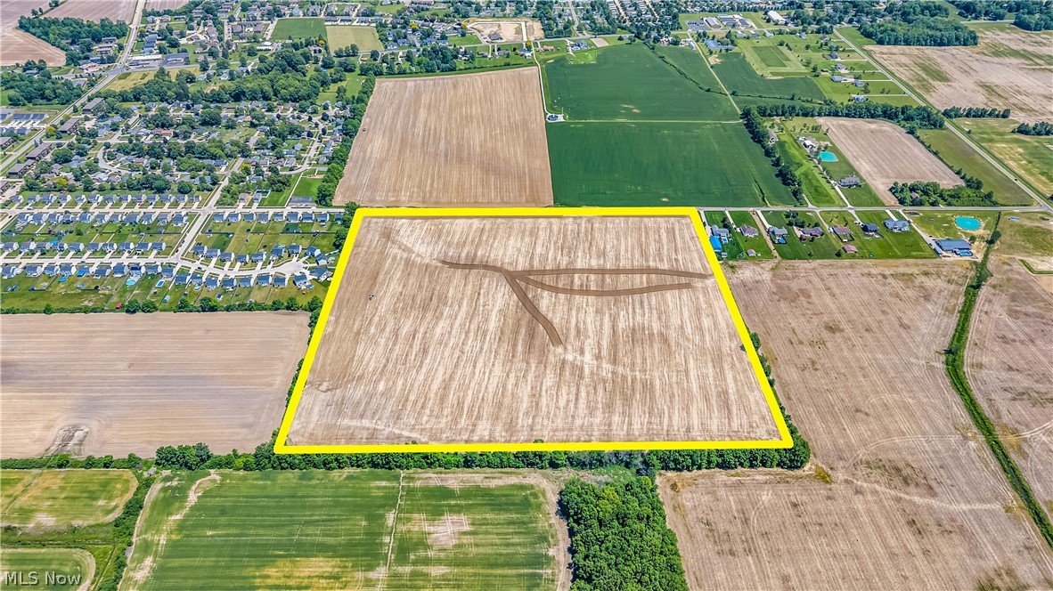 Fowl Road Elyria, OH 44035 - Photo 3 of 10 Expansive aerial parcel featuring cultivated land, defined by a distinct yellow boundary