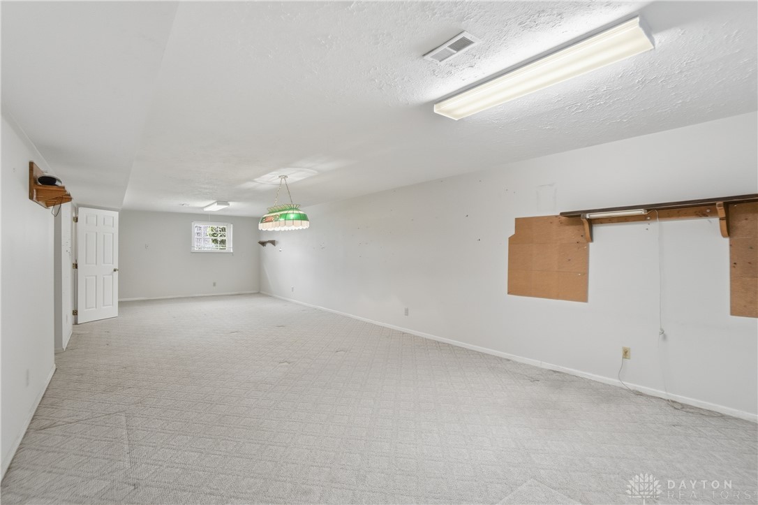 9964 Hummingbird Way Dayton, OH 45458 - Photo 46 of 57 This spacious basement offers ample opportunity for recreation and storage.