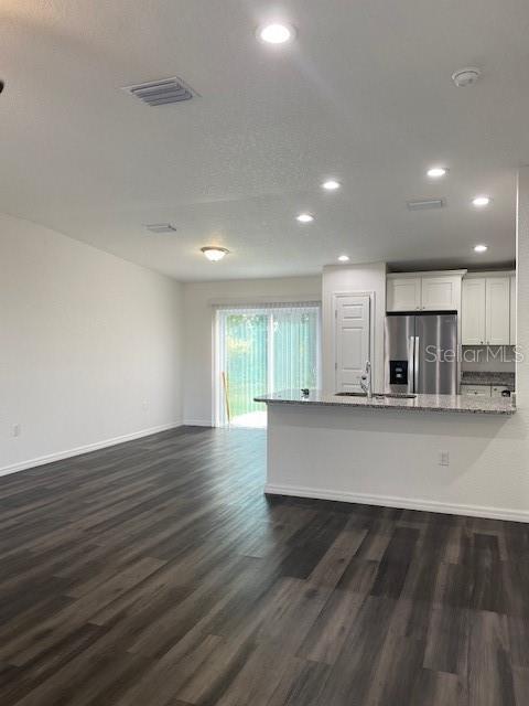 40 Maple Lane Ocklawaha, FL 32179 - Photo 17 of 50 a view of kitchen with stainless steel appliances refrigerator sink and stove