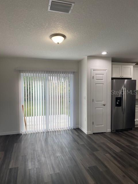 40 Maple Lane Ocklawaha, FL 32179 - Photo 22 of 50 an empty room with wooden floor and windows