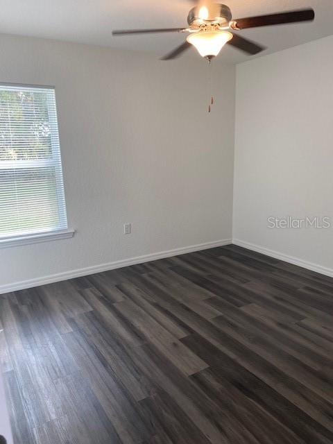 40 Maple Lane Ocklawaha, FL 32179 - Photo 30 of 50 a view of a room with wooden floor and a window