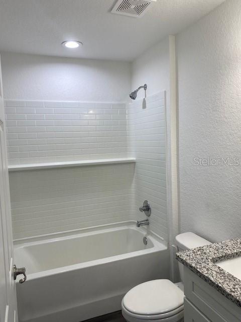 40 Maple Lane Ocklawaha, FL 32179 - Photo 33 of 50 a bathroom with a granite countertop toilet a sink and bathtub