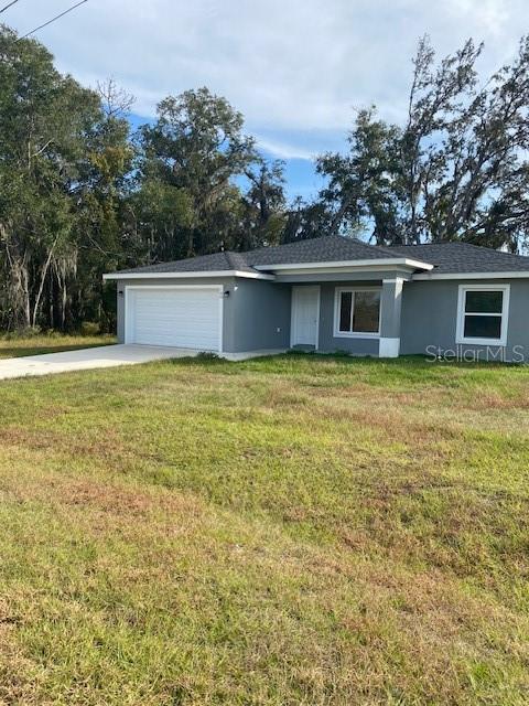40 Maple Lane Ocklawaha, FL 32179 - Photo 50 of 50 a view of a house with a yard