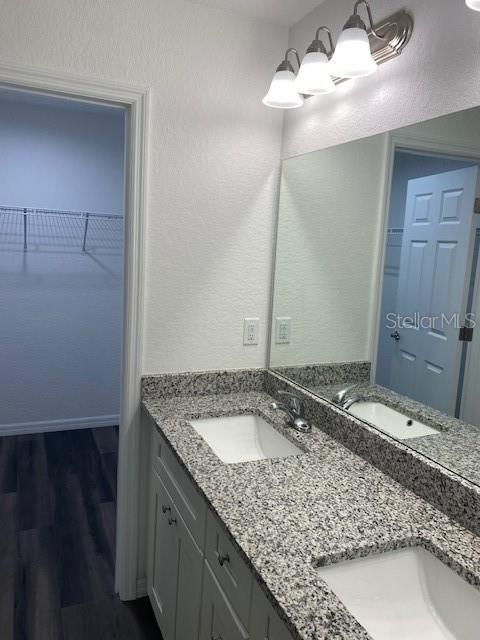 40 Maple Lane Ocklawaha, FL 32179 - Photo 6 of 50 a bathroom with a granite countertop sink and a mirror