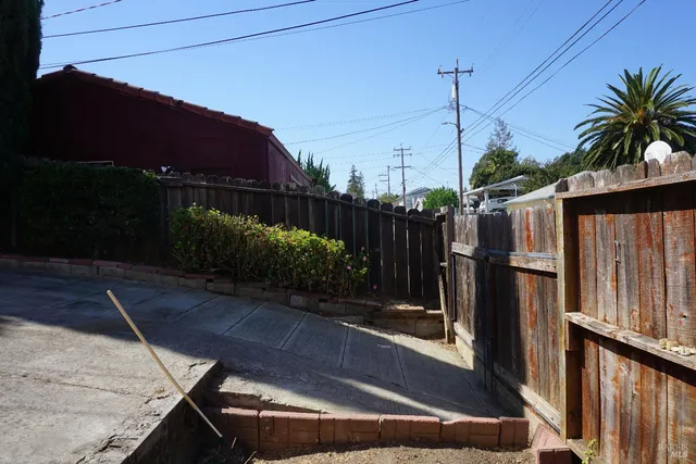 a view of a house with a street