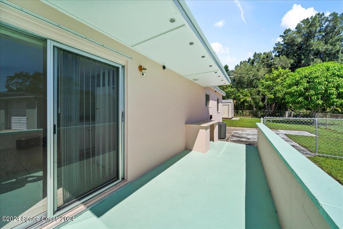 1049 Cable Lane Northeast Palm Bay, FL 32905 - Photo 19 of 24 Side Porch