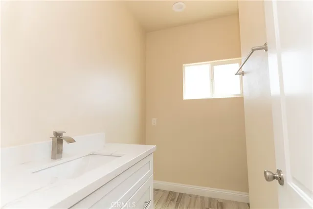 a bathroom with a sink and a window