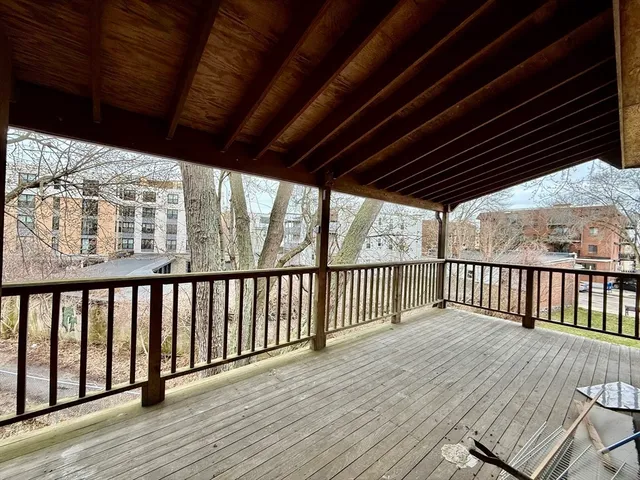 a view of balcony with wooden floor
