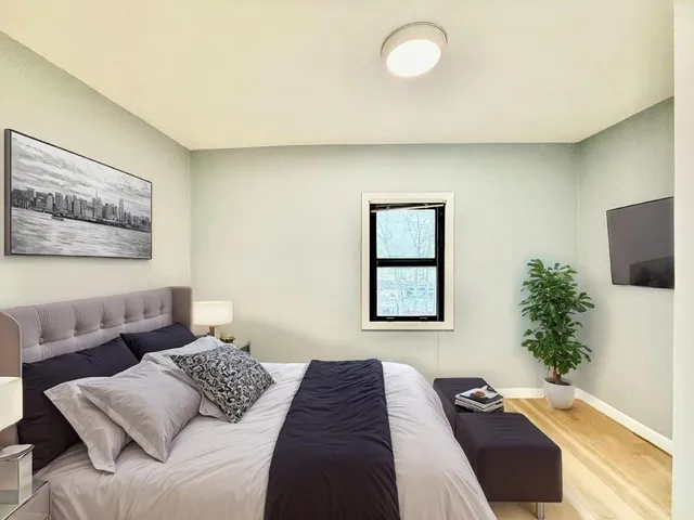 a bedroom with a bed and a couch