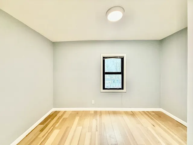 a view of an empty room and window