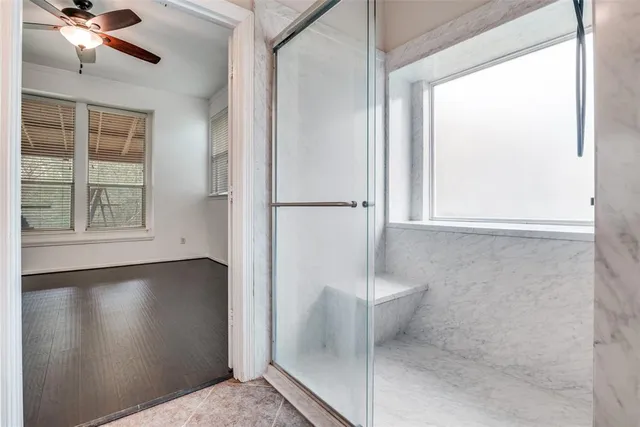 a bathroom with a toilet sink vanity and mirror