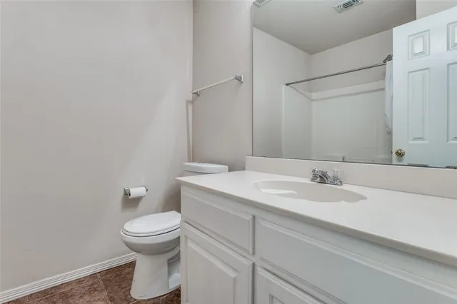 a backyard with a table and chairs