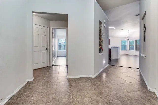 a view of kitchen with refrigerator stove and microwave