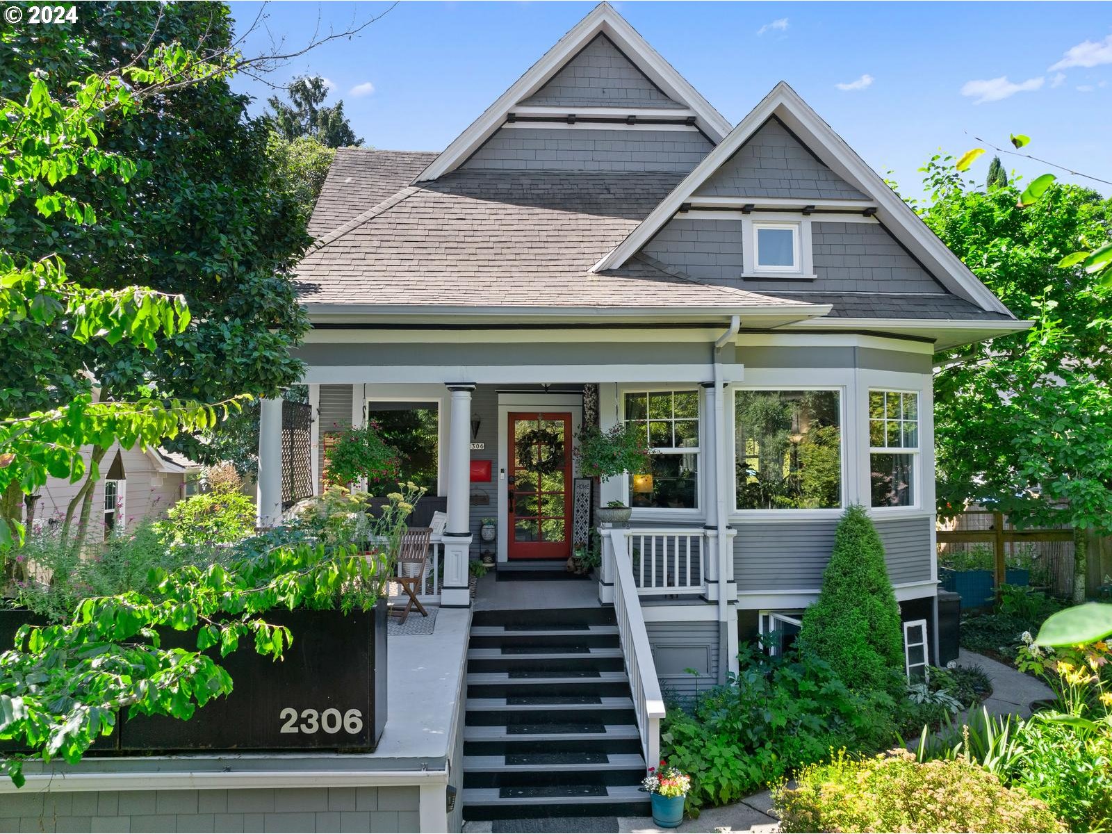 2306 Northeast Couch Street Portland, OR 97232 - Photo 2 of 48 front view of a house with potted plants