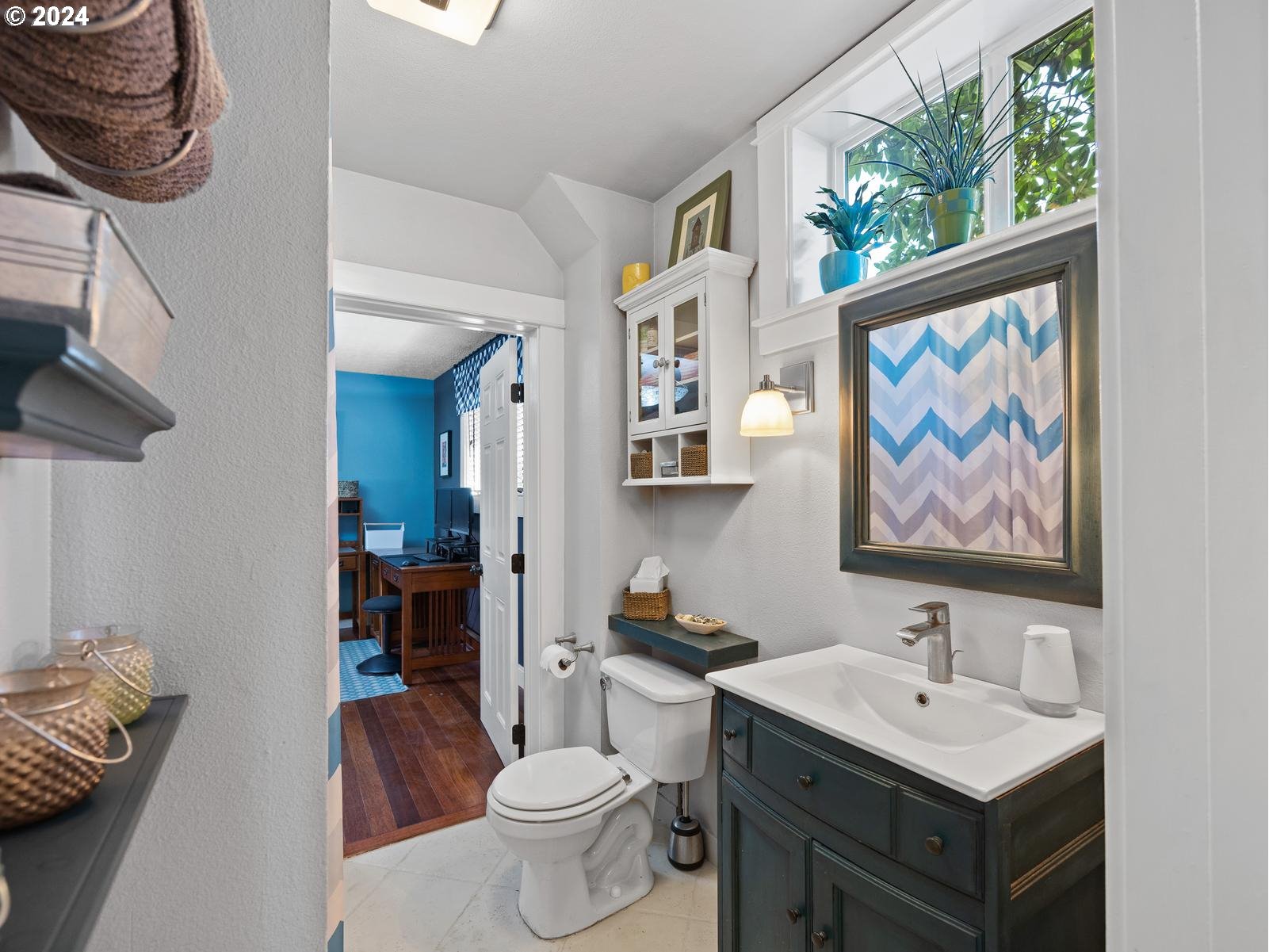 2306 Northeast Couch Street Portland, OR 97232 - Photo 21 of 48 a bathroom with a sink and a mirror