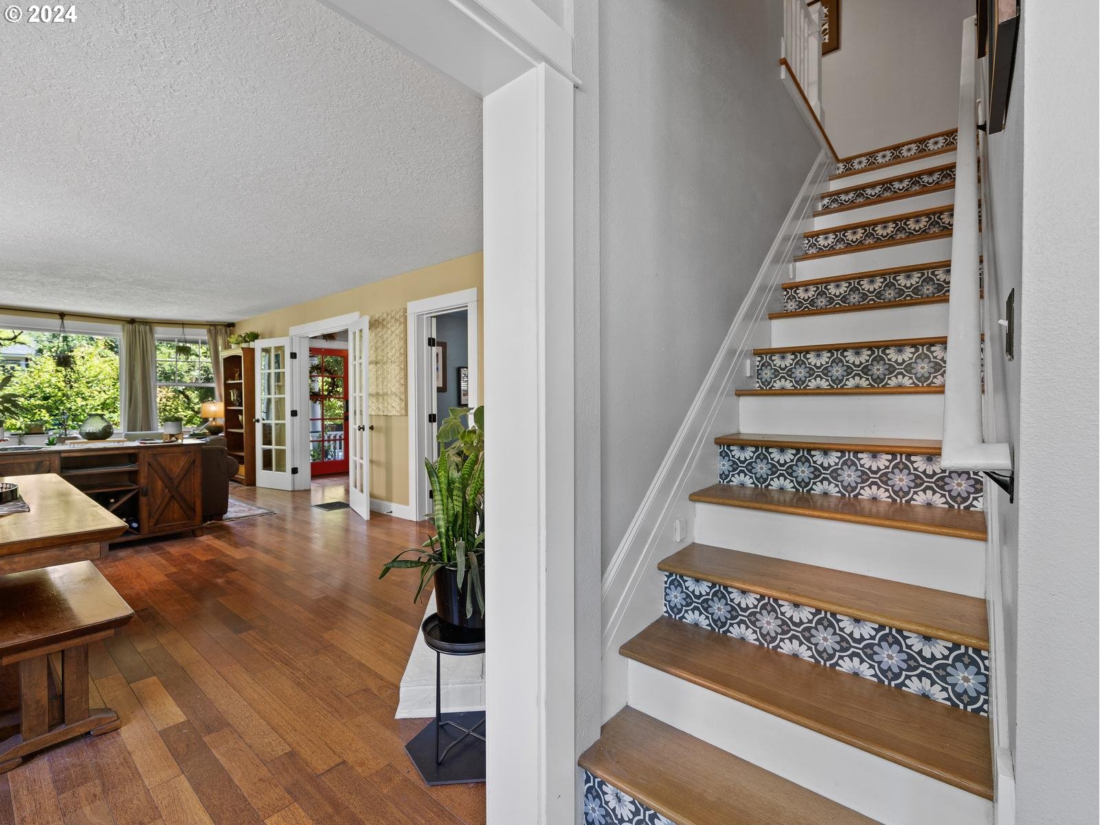 2306 Northeast Couch Street Portland, OR 97232 - Photo 23 of 48 a view of a hallway with wooden floor and furniture