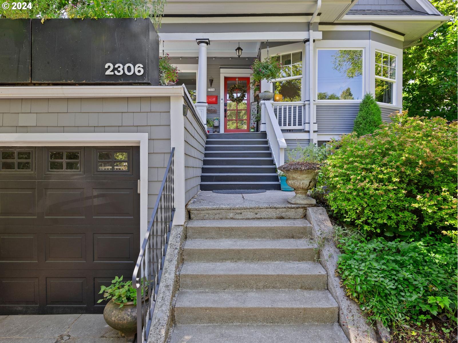 2306 Northeast Couch Street Portland, OR 97232 - Photo 3 of 48 a view of a house with potted plants