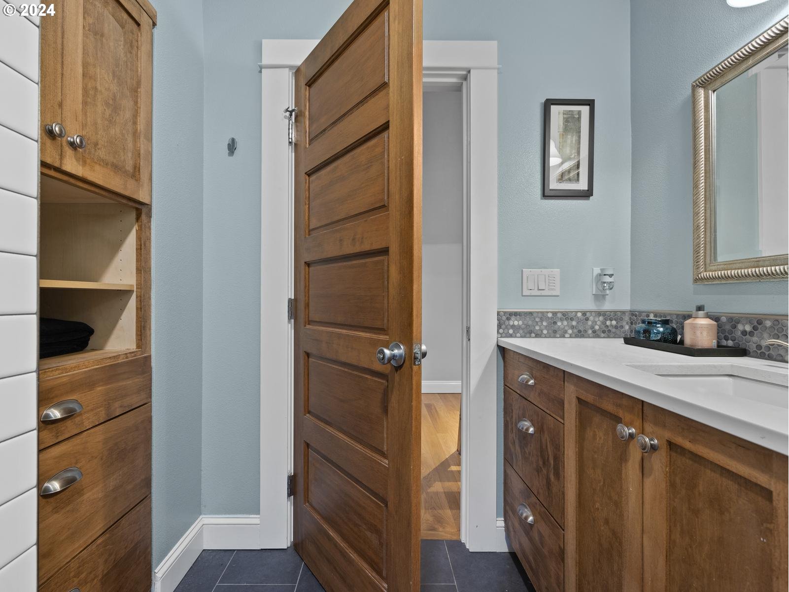 2306 Northeast Couch Street Portland, OR 97232 - Photo 33 of 48 a bathroom with a sink and a mirror