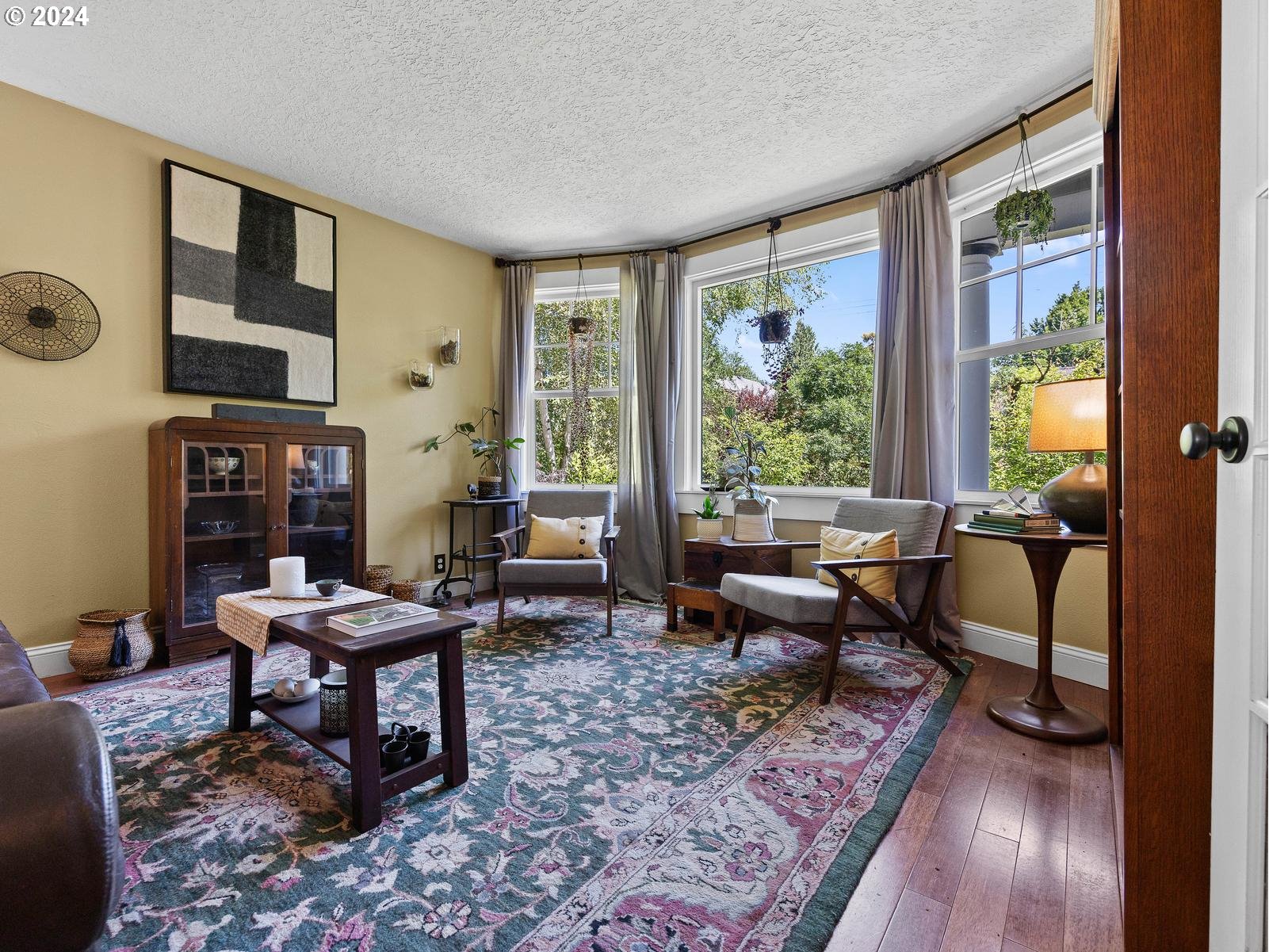 2306 Northeast Couch Street Portland, OR 97232 - Photo 9 of 48 a living room with furniture and a window