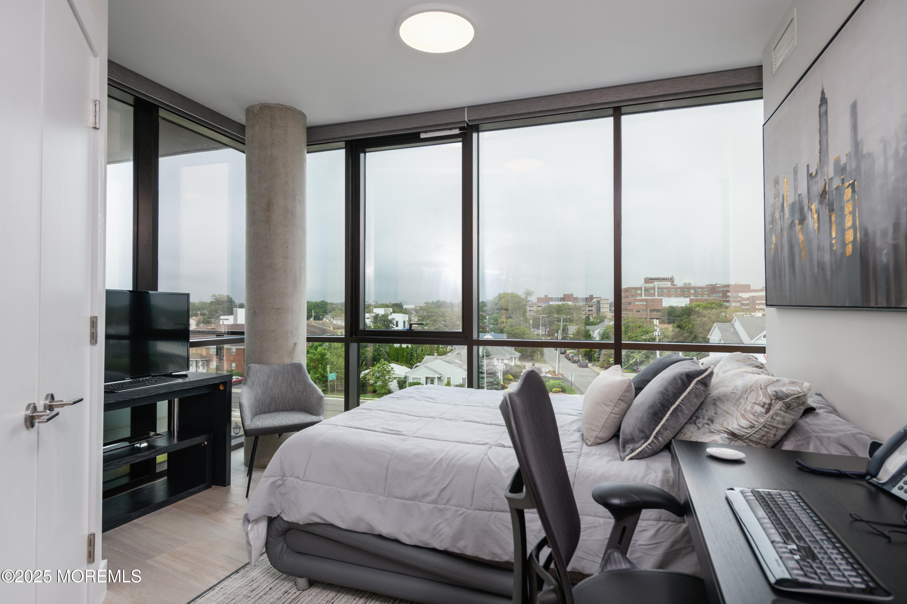 350 Ocean Avenue, Unit 403 Long Branch, NJ 07740 - Photo 11 of 23 a balcony with furniture and a floor to ceiling window