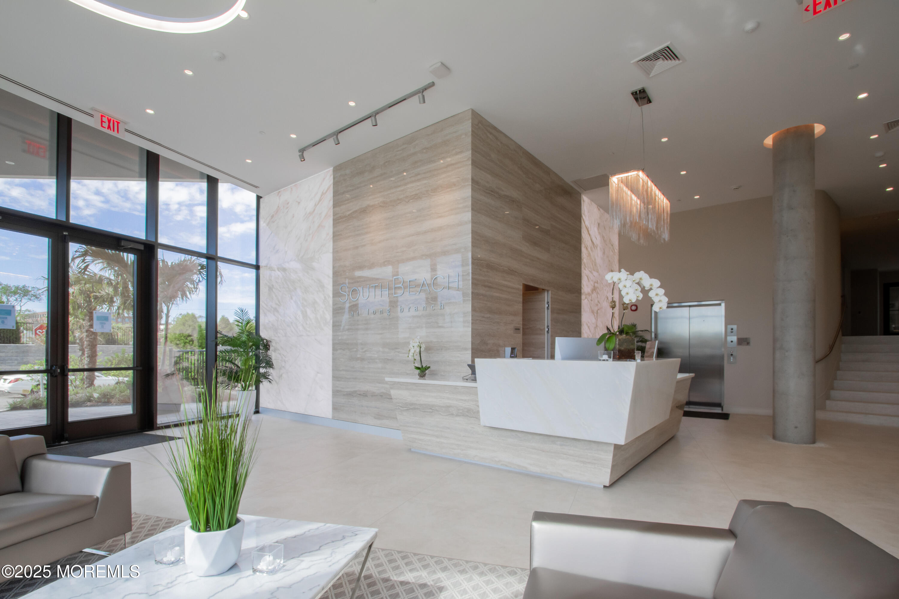 350 Ocean Avenue, Unit 403 Long Branch, NJ 07740 - Photo 2 of 23 a living room with furniture and potted plant