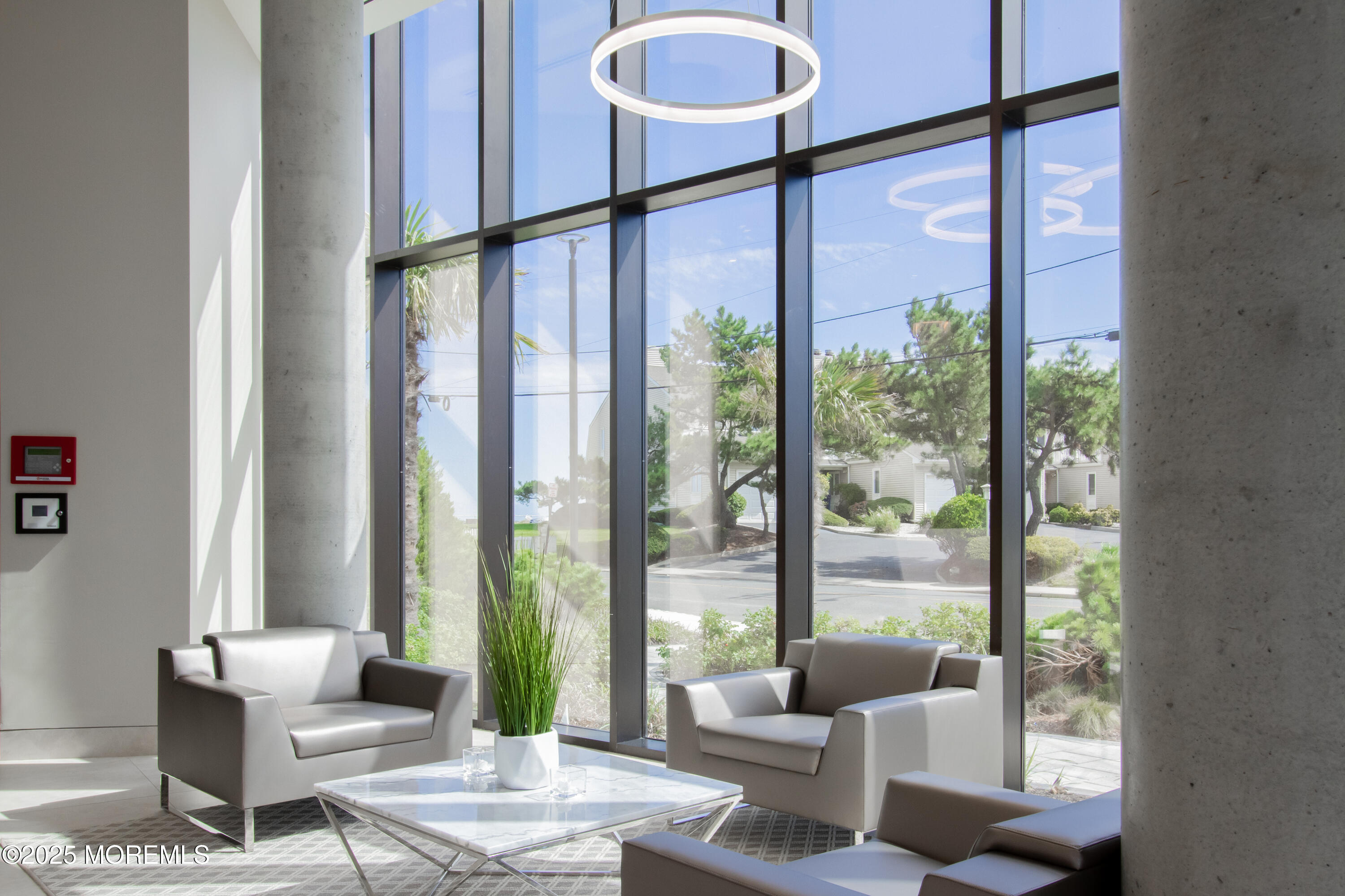 350 Ocean Avenue, Unit 403 Long Branch, NJ 07740 - Photo 3 of 23 a living room with furniture and a potted plant