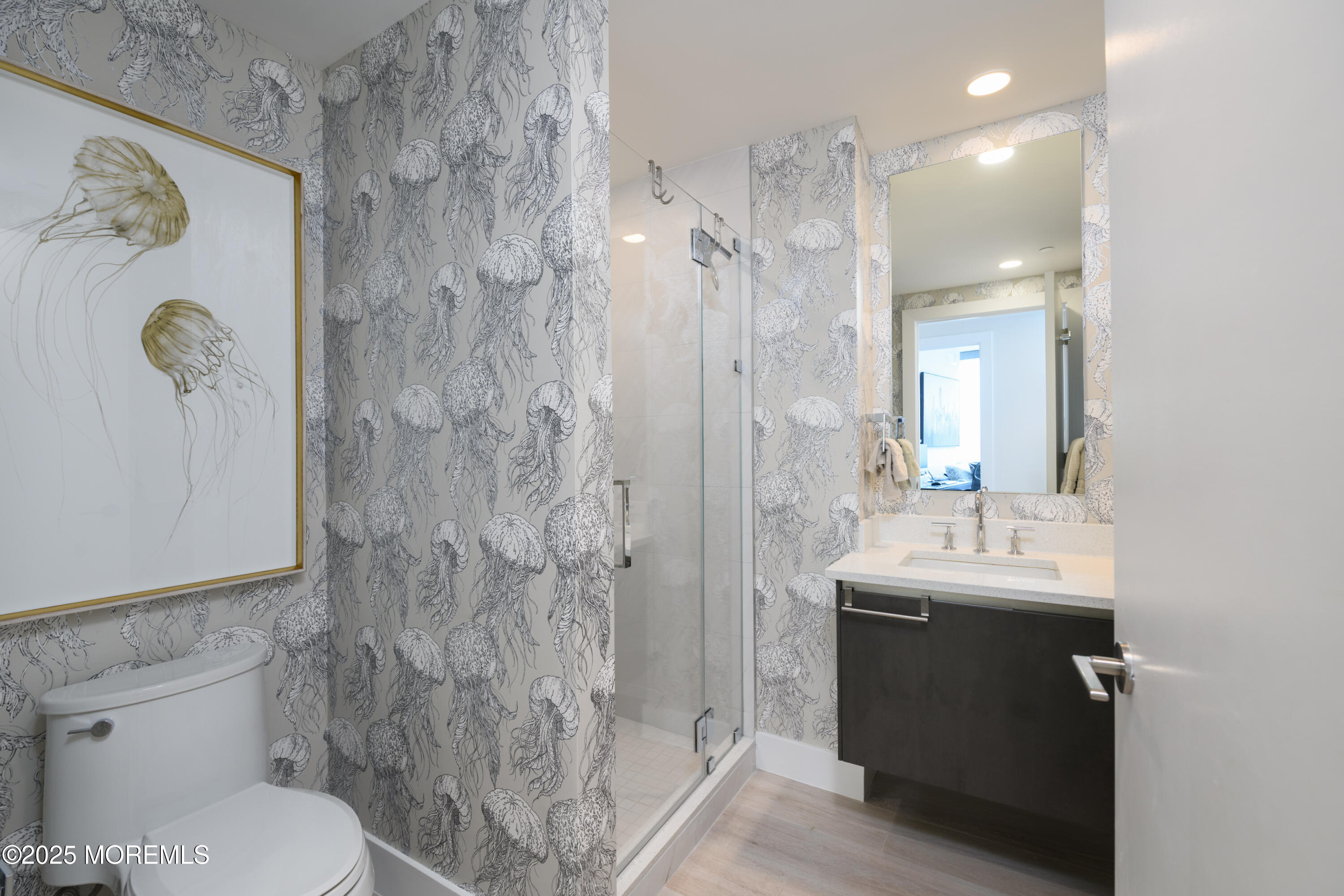 350 Ocean Avenue, Unit 403 Long Branch, NJ 07740 - Photo 10 of 23 a bathroom with a sink a toilet and shower