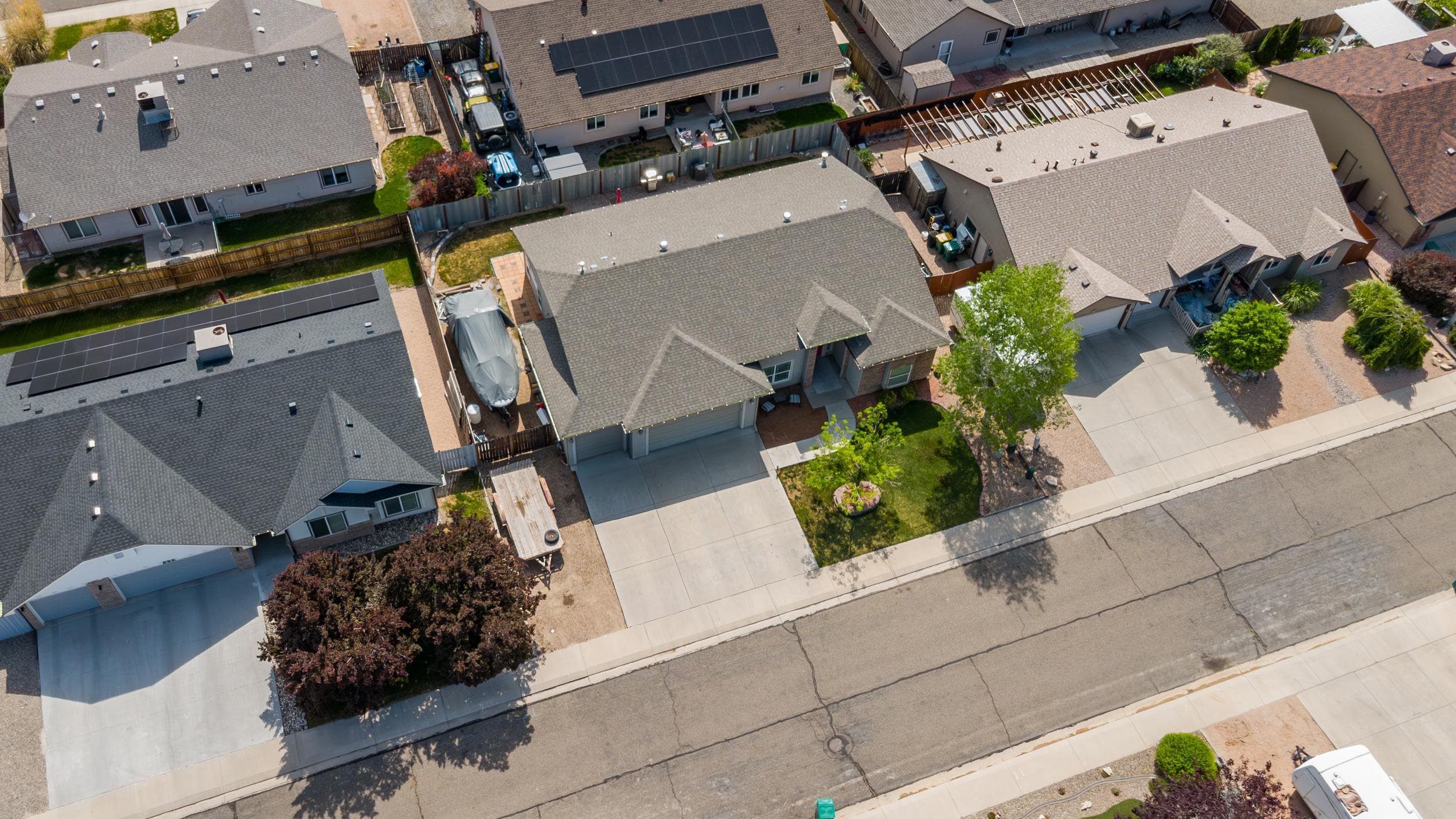 544 Hemlock Drive Fruita, CO 81521 - Photo 29 of 36 an aerial view of a house with a yard and a garage