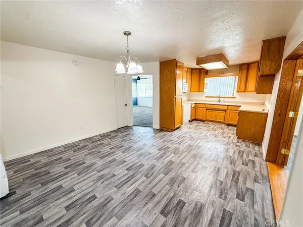a view of a room with wooden floor