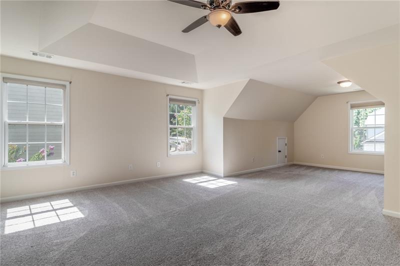 206 Sawtooth Court Canton, GA 30114 - Photo 17 of 42 an empty room with windows and fan