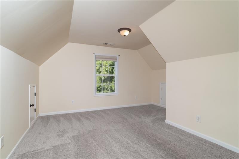 206 Sawtooth Court Canton, GA 30114 - Photo 18 of 42 an empty room with windows
