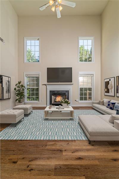 206 Sawtooth Court Canton, GA 30114 - Photo 2 of 42 a living room with furniture and a fireplace