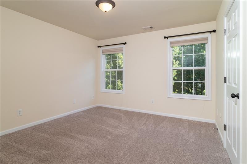 206 Sawtooth Court Canton, GA 30114 - Photo 23 of 42 an empty room with windows