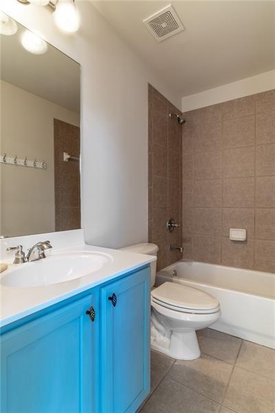 206 Sawtooth Court Canton, GA 30114 - Photo 27 of 42 a bathroom with a sink a toilet and shower