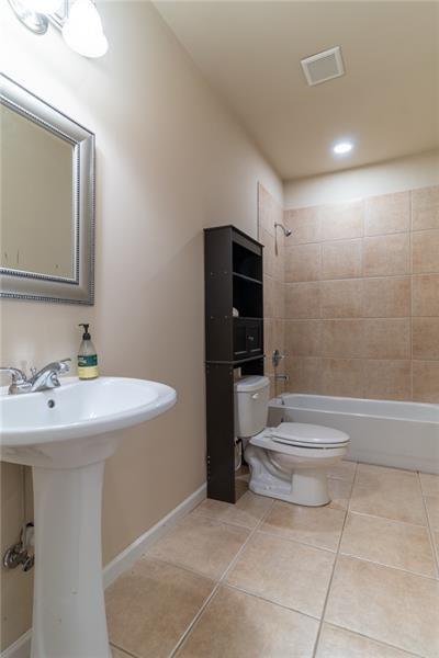 206 Sawtooth Court Canton, GA 30114 - Photo 29 of 42 a bathroom with a sink toilet and shower